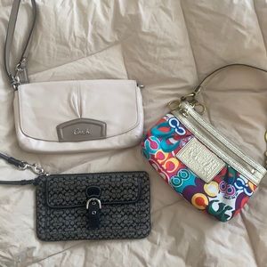 Three Coach wristlet wallets